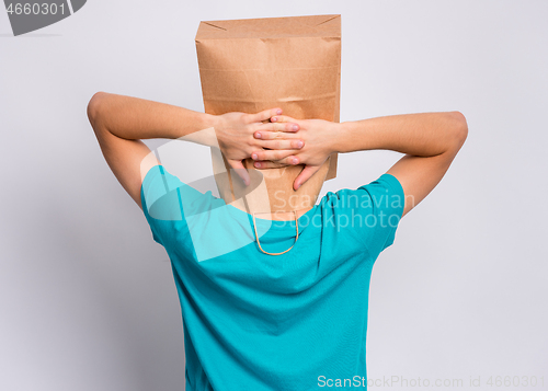 Image of Boy with paper bag over head