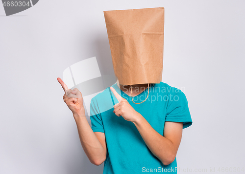 Image of Boy with paper bag over head