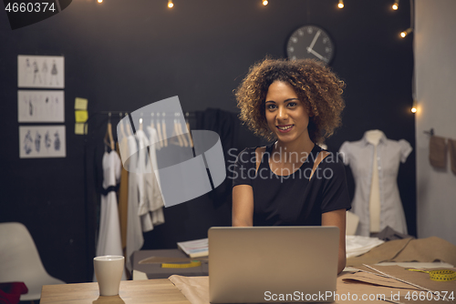 Image of Fashion designer on her Atelier