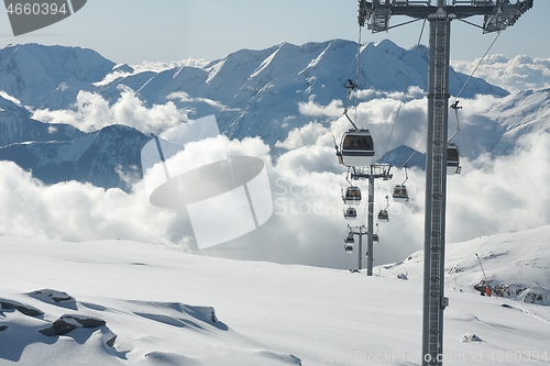 Image of Ski lift cabin in snowy mountain landscape
