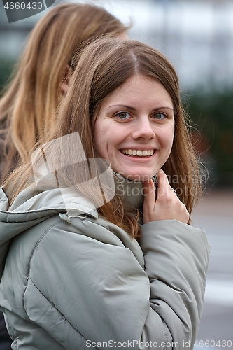 Image of Portrait of a young woman on a street
