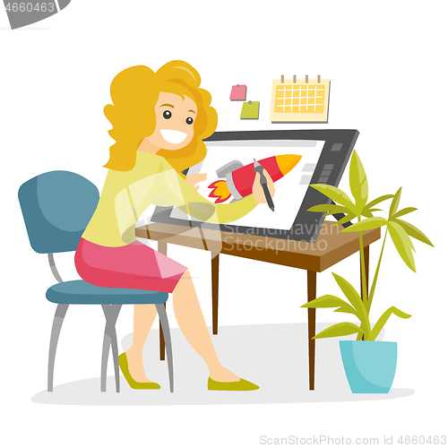 Image of A white woman graphic designer works at the office desk.