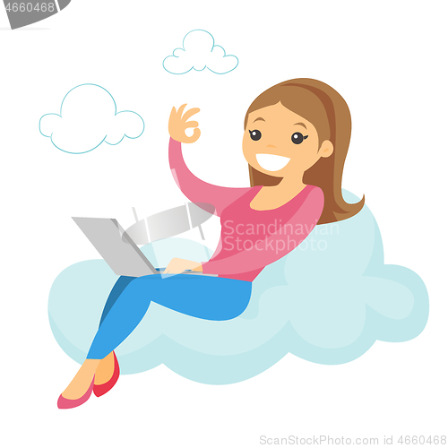 Image of A woman on a cloud working on a laptop and showing ok sign.