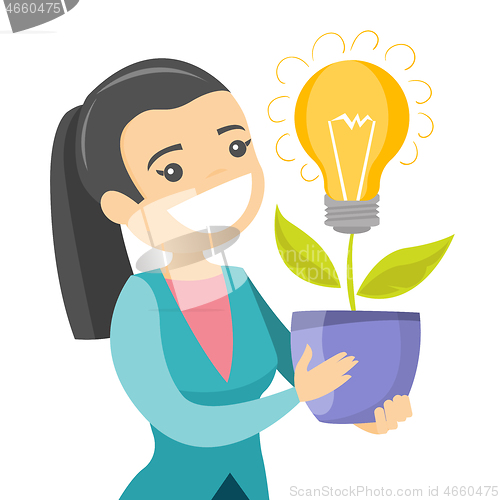 Image of A businesswoman with a lightbulb as a symbol of business idea.