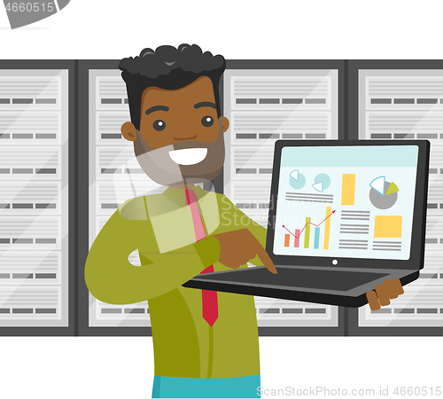 Image of Black man in data center with a laptop