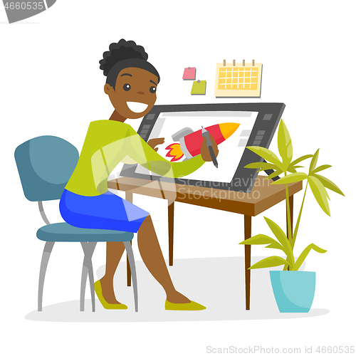 Image of A black woman graphic designer works at the office desk.