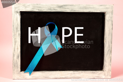 Image of Blue ribbon symbolic of prostate cancer awareness campaign and men\'s health in November