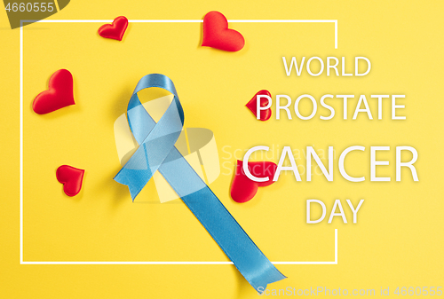 Image of Blue ribbon symbolic of prostate cancer awareness campaign and m