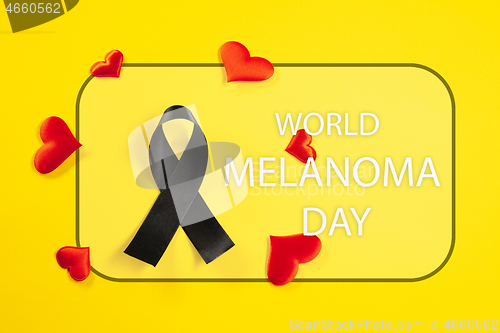 Image of Black ribbon-symbol of fight against melanoma and skin cancer.