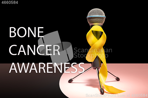 Image of Yellow ribbon symbolic color for Sarcoma Bone cancer awareness and suicide prevention