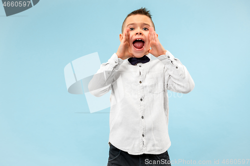 Image of Isolated on pink young casual boy shouting at studio