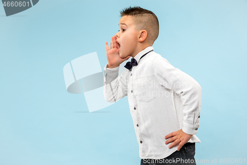 Image of Isolated on pink young casual boy shouting at studio