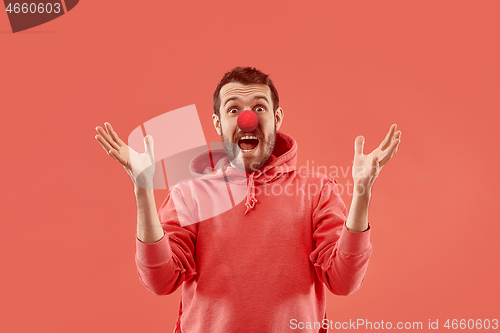 Image of Happy man on red nose day.