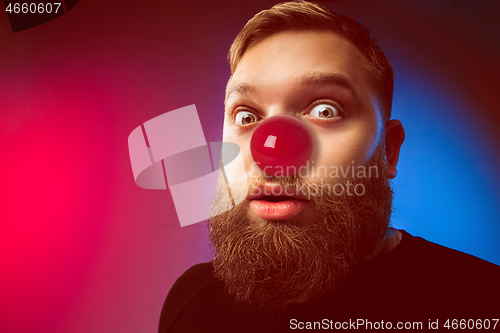 Image of Happy man on red nose day.