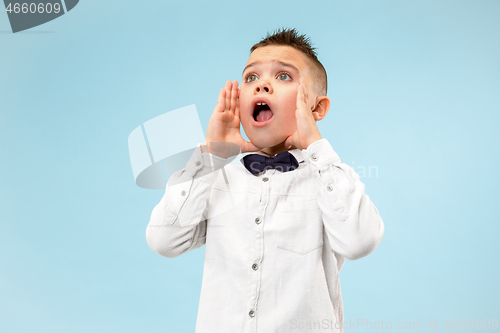 Image of Isolated on pink young casual boy shouting at studio