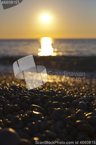 Image of Beautiful seascape, amazing view of pebble coastline in mild sun