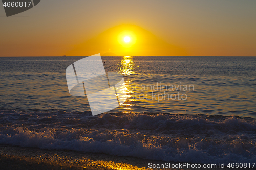 Image of Red sunset over the sea. Beautiful sunset.