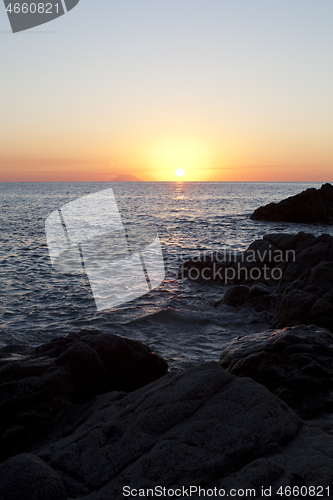 Image of Sunset on the rocky shore. Tyrrhenian Sea.