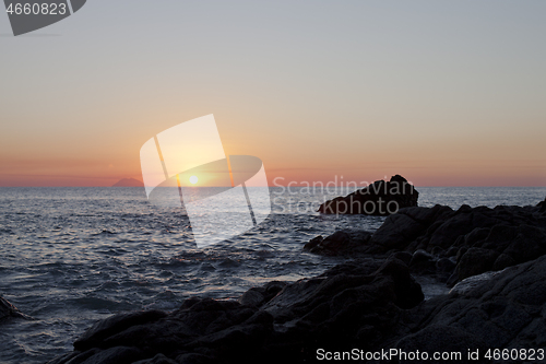 Image of Sunset on the rocky shore. Tyrrhenian Sea.