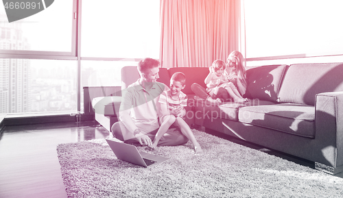 Image of Happy family playing a video game