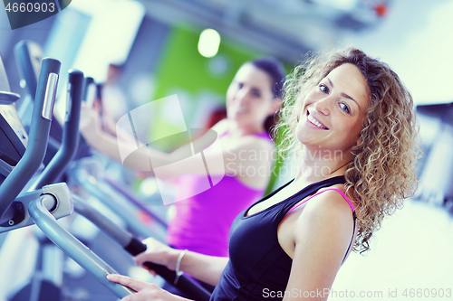 Image of Group of people running on treadmills