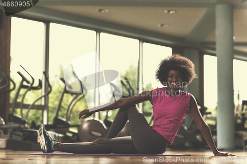 Image of african american woman exercise yoga in gym