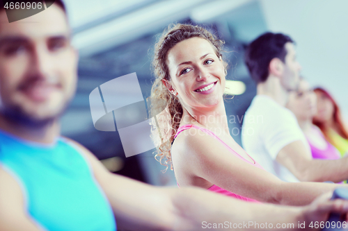 Image of Group of people running on treadmills