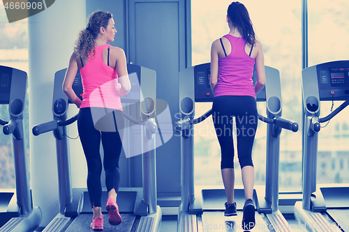 Image of Group of people running on treadmills