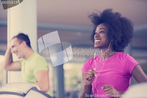 Image of people exercisinng a cardio on treadmill