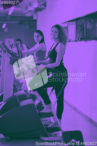 Image of Group of people running on treadmills