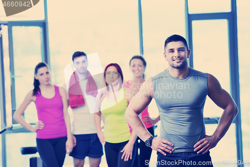 Image of Group of people exercising at the gym