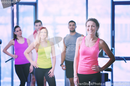 Image of Group of people exercising at the gym