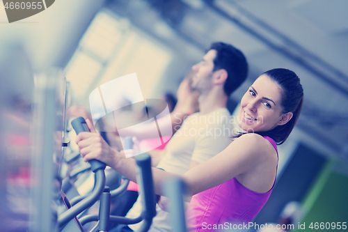 Image of Group of people running on treadmills