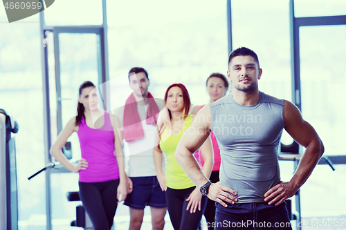 Image of Group of people exercising at the gym