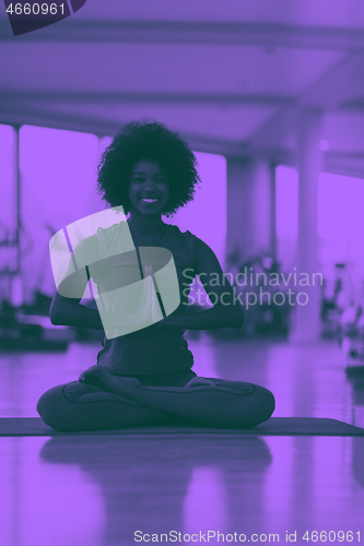 Image of african american woman exercise yoga in gym