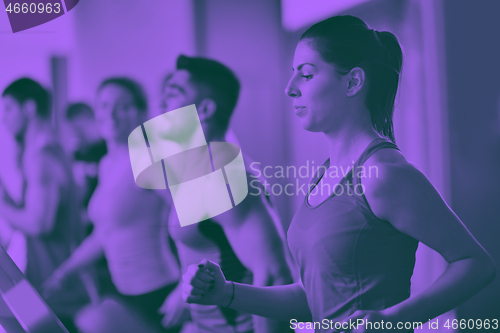 Image of Group of people running on treadmills