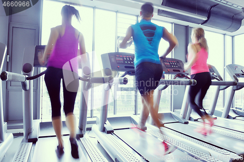 Image of Group of people running on treadmills