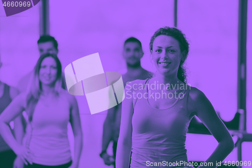 Image of Group of people exercising at the gym