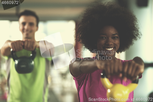 Image of couple  workout with weights at  crossfit gym