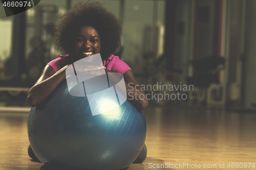 Image of woman  relaxing after pilates workout