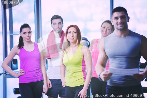 Image of Group of people exercising at the gym