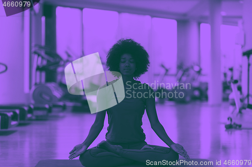 Image of african american woman exercise yoga in gym