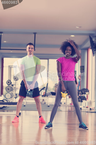 Image of couple  workout with weights at  crossfit gym