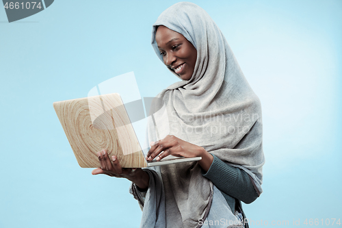 Image of Portrait Of Female University Student Working on laptop