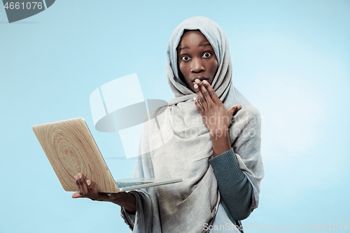 Image of Portrait Of Female University Student Working on laptop