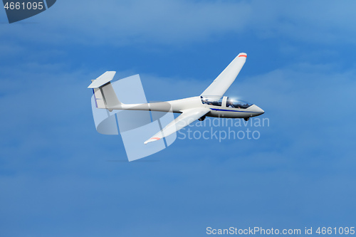 Image of glider up in the blue sky