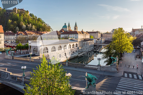 Image of Aerial drone panoramic view of Ljubljana medieval city center, capital of Slovenia in warm afternoon sun. Empty streets during corona virus pandemic social distancing measures