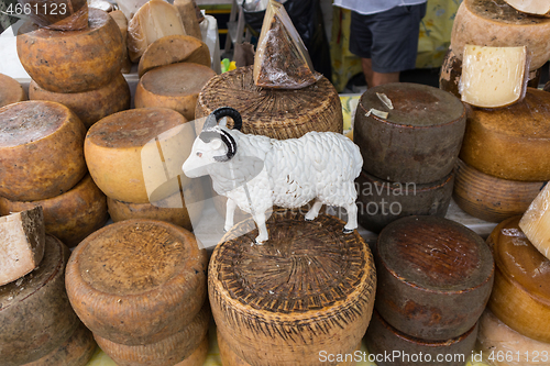 Image of Various traditional Italian cheese on a market stand