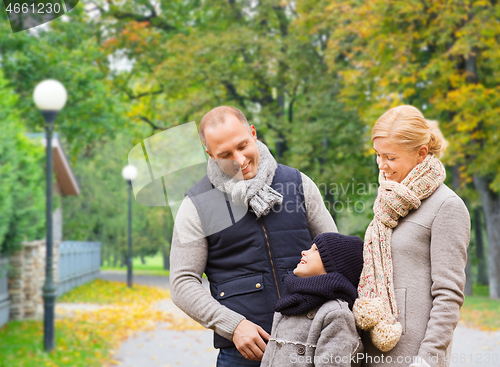 Image of happy family in autumn park