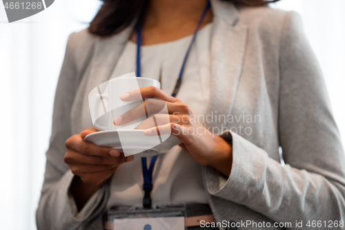 Image of close up of businesswoman drinking coffee